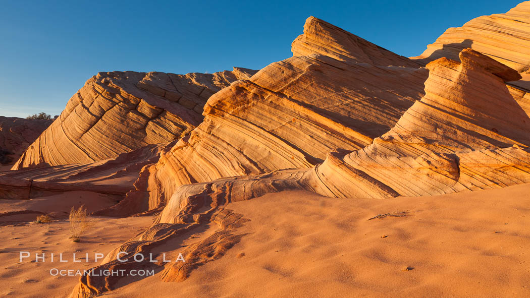 Sandstone "fins", eroded striations that depict how sandstone -- ancient compressed sand -- was laid down in layers over time.  Now exposed, the layer erode at different rates, forming delicate "fins" that stretch for long distances. Navajo Tribal Lands, Page, Arizona, USA, natural history stock photograph, photo id 26645