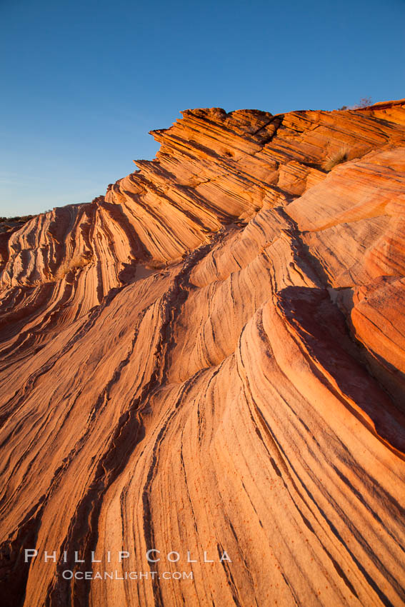 Sandstone "fins", eroded striations that depict how sandstone -- ancient compressed sand -- was laid down in layers over time.  Now exposed, the layer erode at different rates, forming delicate "fins" that stretch for long distances. Navajo Tribal Lands, Page, Arizona, USA, natural history stock photograph, photo id 26677