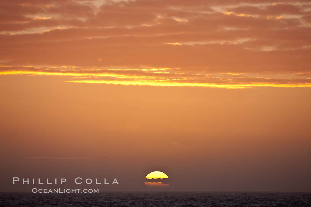 The sun sets on the Southern Ocean in a beautiful sunset., natural history stock photograph, photo id 24166