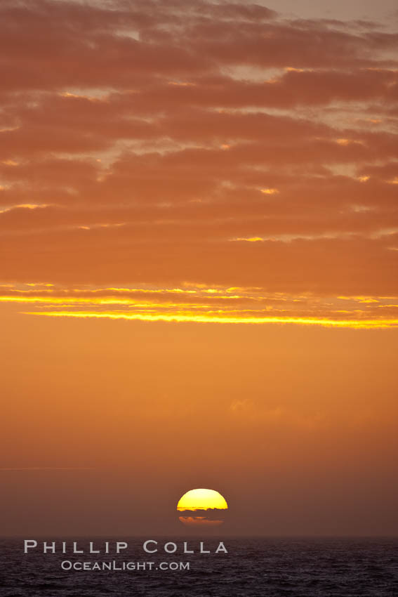 The sun sets on the Southern Ocean in a beautiful sunset., natural history stock photograph, photo id 24167