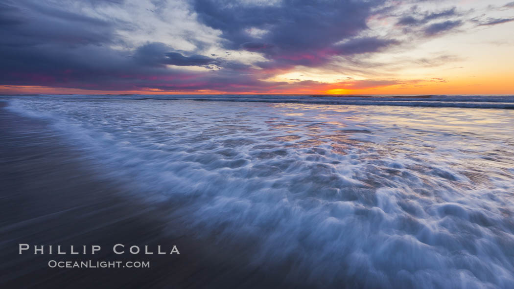 Surf and sky at sunset, waves crash upon the sand at dusk. Carlsbad, California, USA, natural history stock photograph, photo id 27235