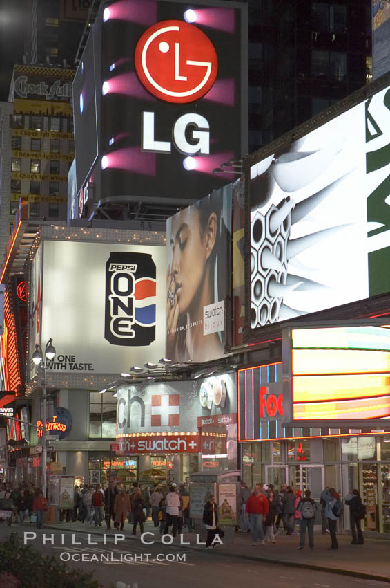 Neon lights fill Times Square at night. New York City, USA, natural history stock photograph, photo id 11210