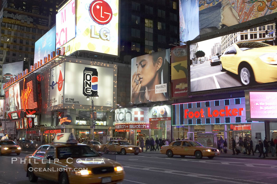 Neon lights fill Times Square at night. New York City, USA, natural history stock photograph, photo id 11199