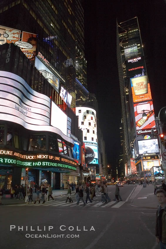 Neon lights fill Times Square at night. New York City, USA, natural history stock photograph, photo id 11209