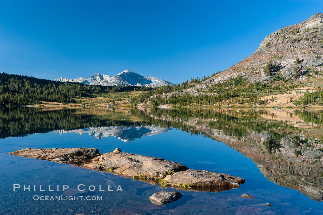 Sunrise reflections in Tioga Lake. This spectacular location is just a short walk from the Tioga Pass road. Near Tuolumne Meadows and Yosemite National Park. California, USA, natural history stock photograph, photo id 09950