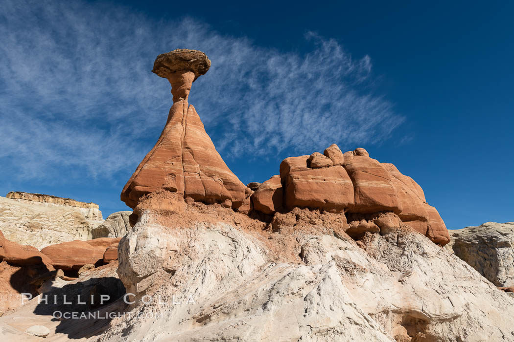 Toadstool Hoodoos near the Paria Rimrocks, Grand Staircase Escalante National Monument. These hoodoos form when erosion occurs around but not underneath a more resistant caprock that sits atop of the hoodoo spire. Grand Staircase - Escalante National Monument, Utah, USA, natural history stock photograph, photo id 37782