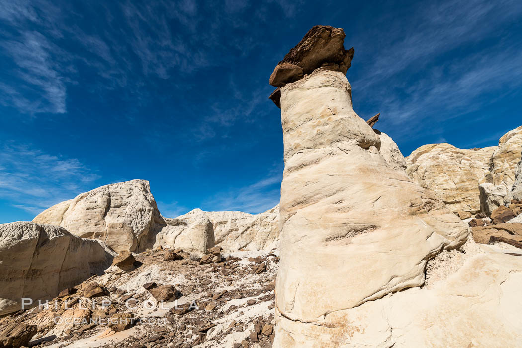 Toadstool Hoodoos near the Paria Rimrocks, Grand Staircase Escalante National Monument. These hoodoos form when erosion occurs around but not underneath a more resistant caprock that sits atop of the hoodoo spire. Grand Staircase - Escalante National Monument, Utah, USA, natural history stock photograph, photo id 37785