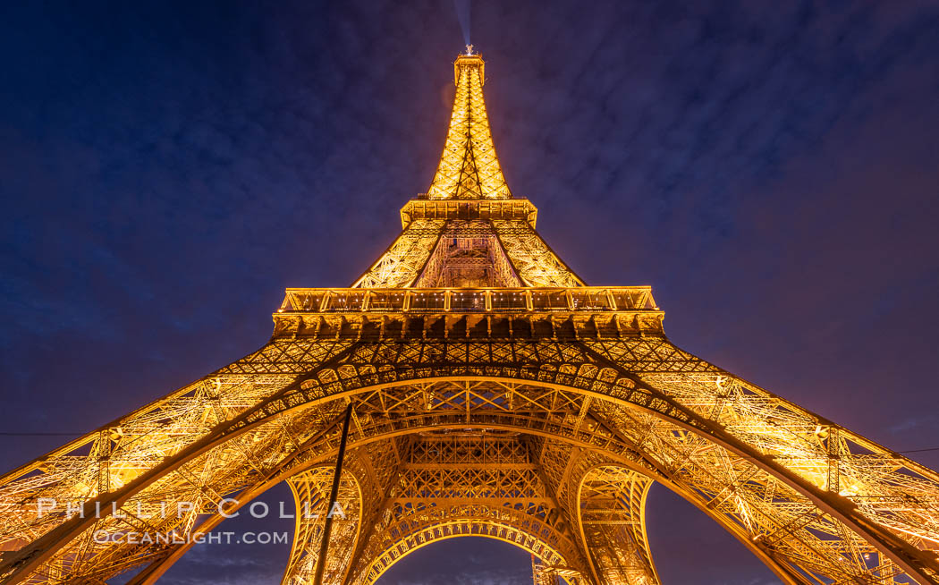 La Tour Eiffel. The Eiffel Tower is an iron lattice tower located on the Champ de Mars in Paris, named after the engineer Gustave Eiffel, who designed the tower in 1889 as the entrance arch to the 1889 World's Fair. The Eiffel tower is the tallest structure in Paris and the most-visited paid monument in the world. France, natural history stock photograph, photo id 35608