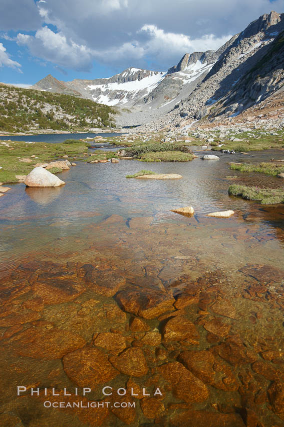 Townsley Lake (10396'), a beautiful alpine lake sitting below blue sky, clouds and Fletcher Peak (right), lies amid the Cathedral Range of glacier-sculpted granite peaks in Yosemite's high country, near Vogelsang High Sierra Camp. Yosemite National Park, California, USA, natural history stock photograph, photo id 23228