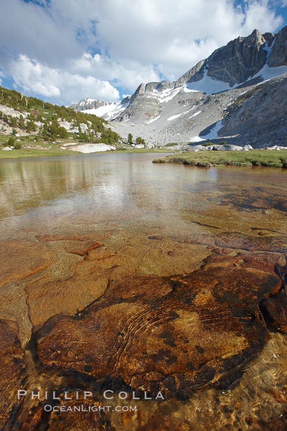 Townsley Lake, a beautiful alpine lake sitting below blue sky, clouds and Fletcher Peak (right), lies amid the Cathedral Range of glacier-sculpted granite peaks in Yosemite's high country, near Vogelsang High Sierra Camp. Yosemite National Park, California, USA, natural history stock photograph, photo id 23252