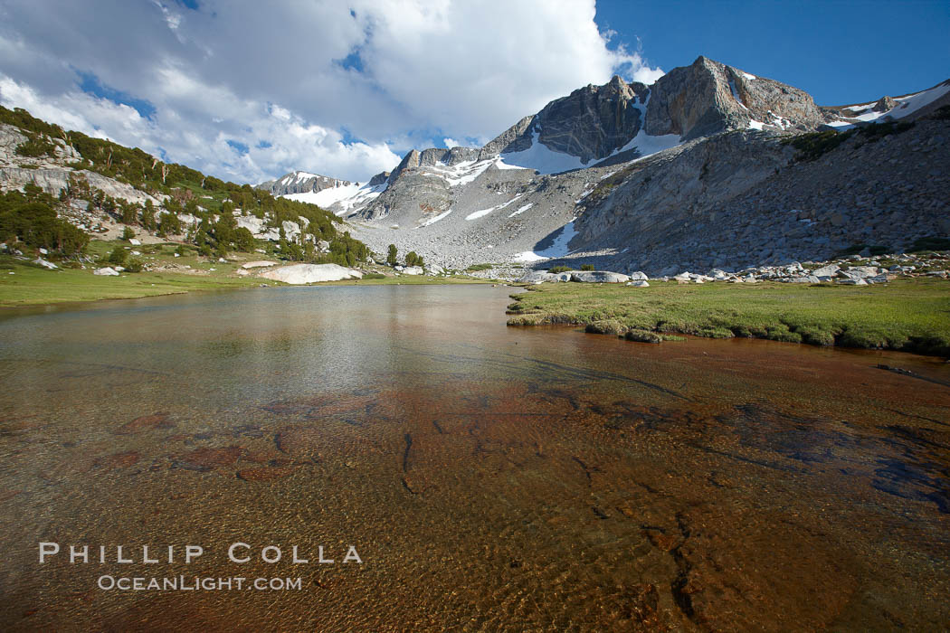 Townsley Lake, a beautiful alpine lake sitting below blue sky, clouds and Fletcher Peak (right), lies amid the Cathedral Range of glacier-sculpted granite peaks in Yosemite's high country, near Vogelsang High Sierra Camp. Yosemite National Park, California, USA, natural history stock photograph, photo id 23256