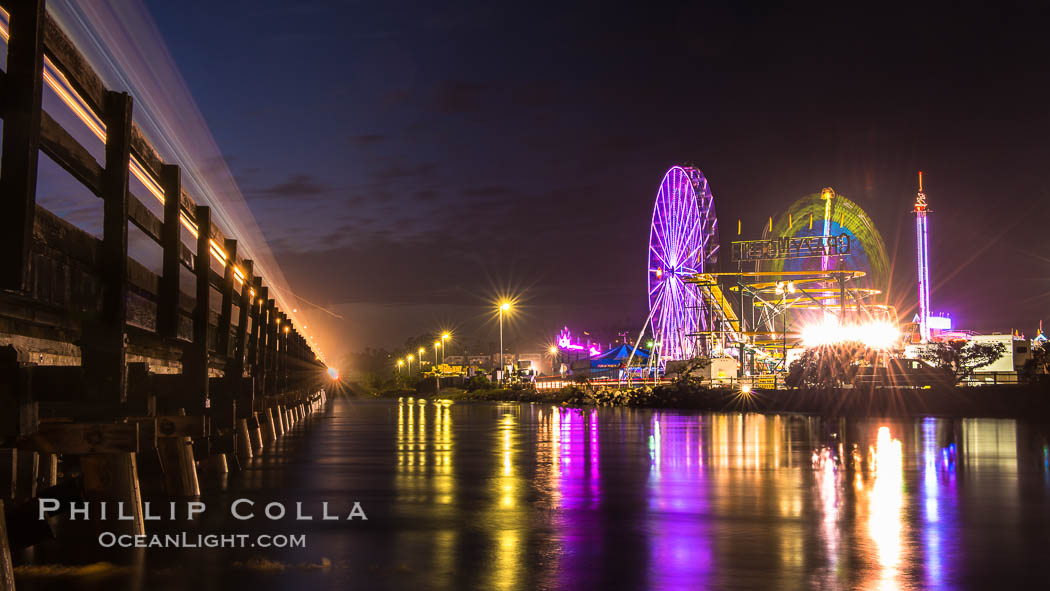 Train lights, Del Mar Fair and San Dieguito Lagoon at Night.  Lights from the San Diego Fair reflect in San Dieguito Lagooon, with the train track trestles to the left. California, USA, natural history stock photograph, photo id 31025
