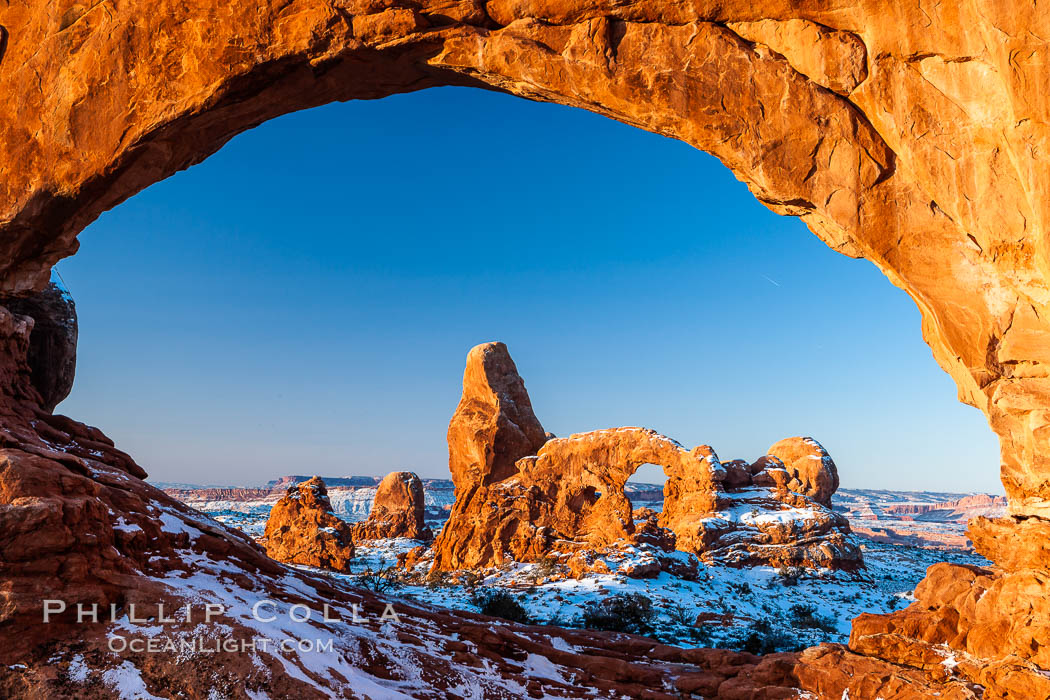 Turret Arch through North Window, winter, sunrise. Arches National Park, Utah, USA, natural history stock photograph, photo id 18118