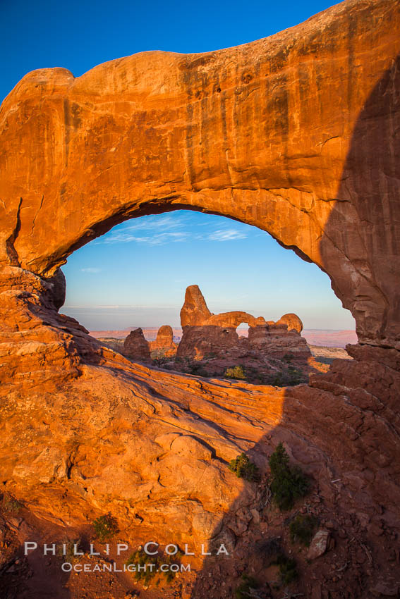 Sunrise light on Turret Arch viewed through North Window. Arches National Park, Utah, USA, natural history stock photograph, photo id 27873