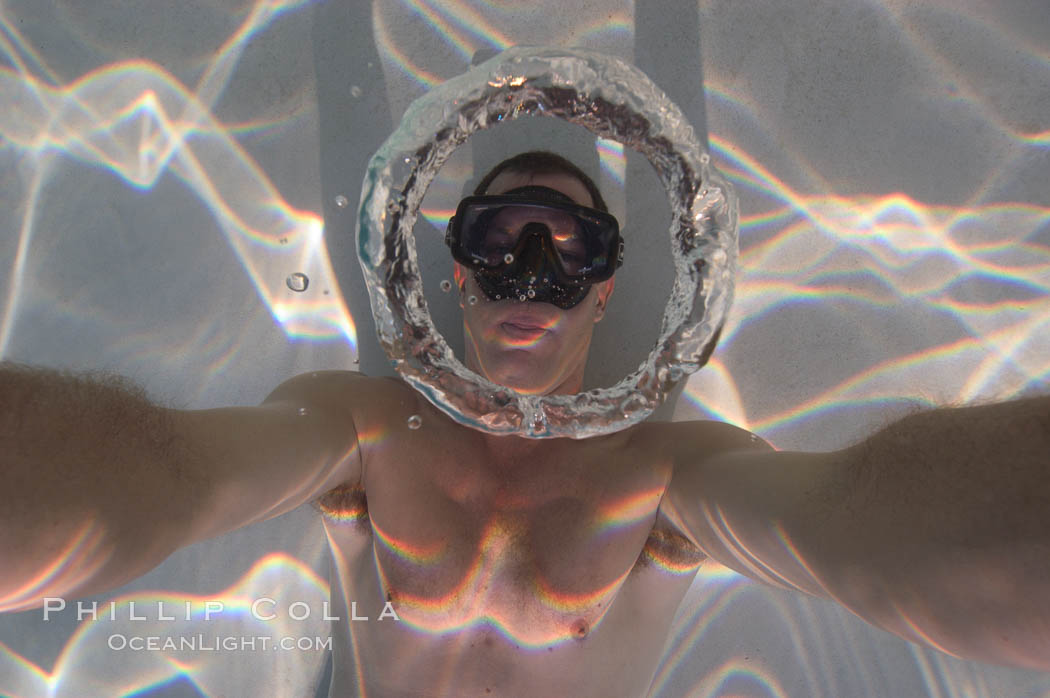 A underwater bubble ring!  Similar to the rings created by smokers, an underwater bubble ring can be made by exhaling just right.  When done correctly, the ring will rise toward the surface keeping its perfect toroidal form until it reaches a state of instability and breaks up., natural history stock photograph, photo id 07752