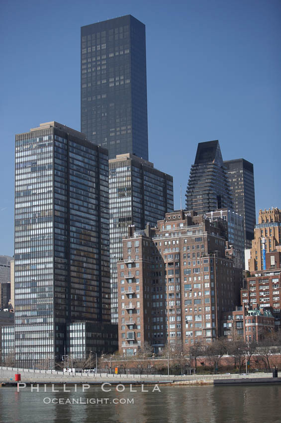 New York Citys Upper East Side, viewed from the East River.  The Trump World Tower rises in the background. Manhattan, USA, natural history stock photograph, photo id 11136