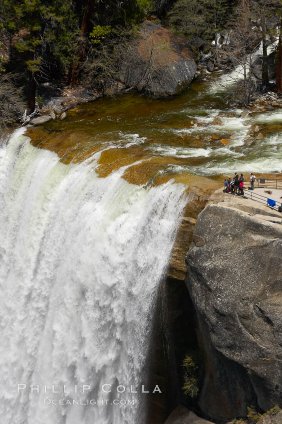 Vernal Falls at peak flow in late spring. Hikers are seen at the precipice to Vernal Falls, having hiked up the Mist Trail to get there. Yosemite National Park, California, USA, natural history stock photograph, photo id 12637