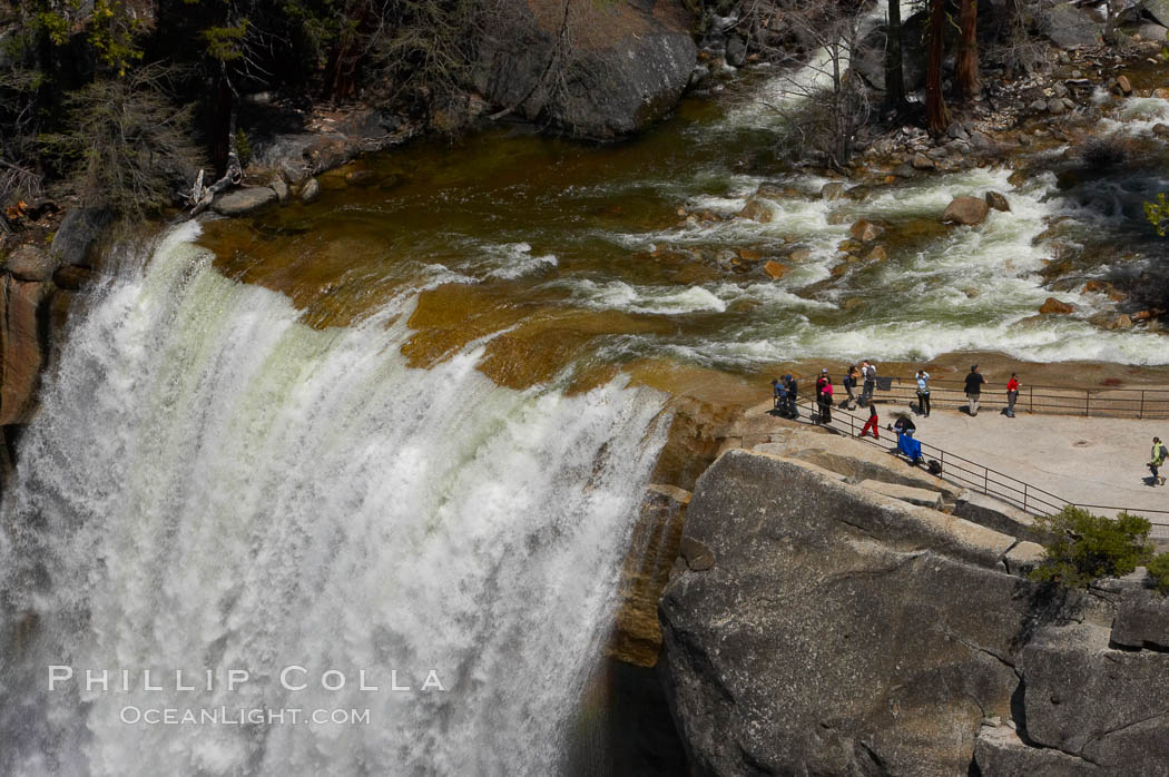 Vernal Falls at peak flow in late spring. Hikers are seen at the precipice to Vernal Falls, having hiked up the Mist Trail to get there. Yosemite National Park, California, USA, natural history stock photograph, photo id 12641