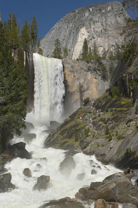 Vernal Falls and the Merced River, at peak flow in late spring.  Hikers ascending the Mist Trail visible at right.  Vernal Falls drops 317 through a joint in the narrow Little Yosemite Valley. Yosemite National Park, California, USA, natural history stock photograph, photo id 16113