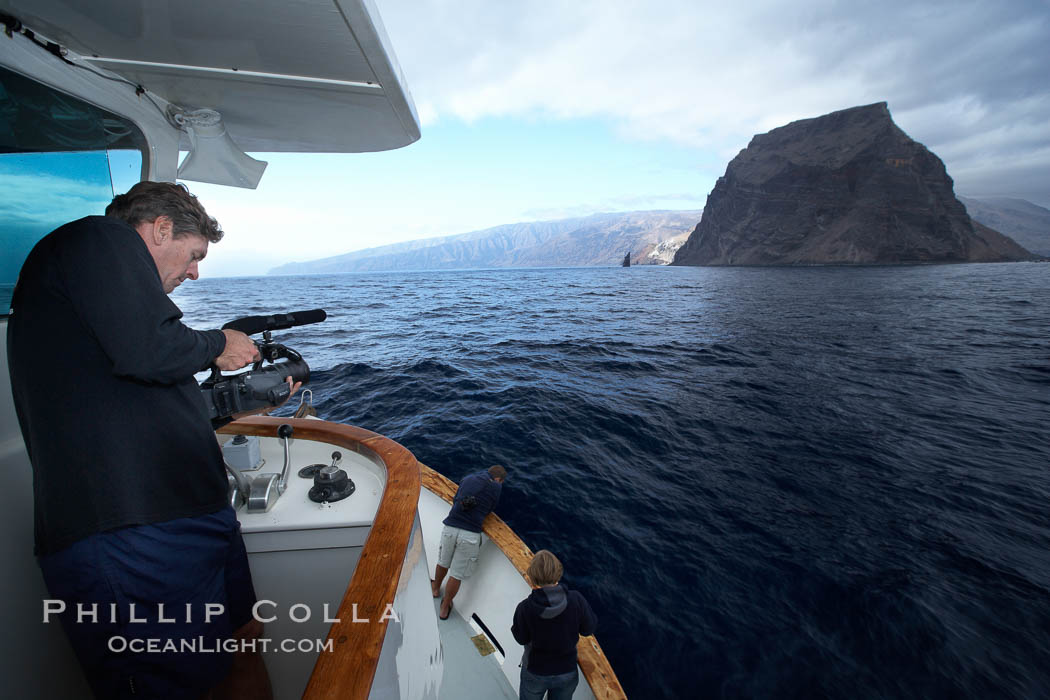 Videographer filming approach to Guadalupe Island. Guadalupe Island (Isla Guadalupe), Baja California, Mexico, natural history stock photograph, photo id 21395