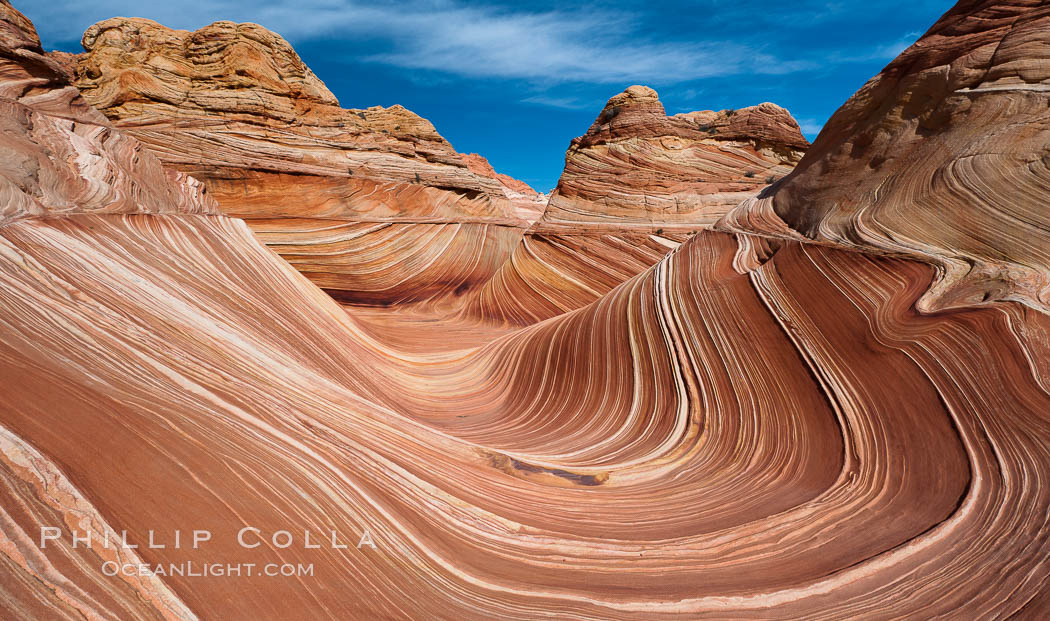The Wave, an area of fantastic eroded sandstone featuring beautiful swirls, wild colors, countless striations, and bizarre shapes set amidst the dramatic surrounding North Coyote Buttes of Arizona and Utah.  The sandstone formations of the North Coyote Buttes, including the Wave, date from the Jurassic period. Managed by the Bureau of Land Management, the Wave is located in the Paria Canyon-Vermilion Cliffs Wilderness and is accessible on foot by permit only. USA, natural history stock photograph, photo id 20625