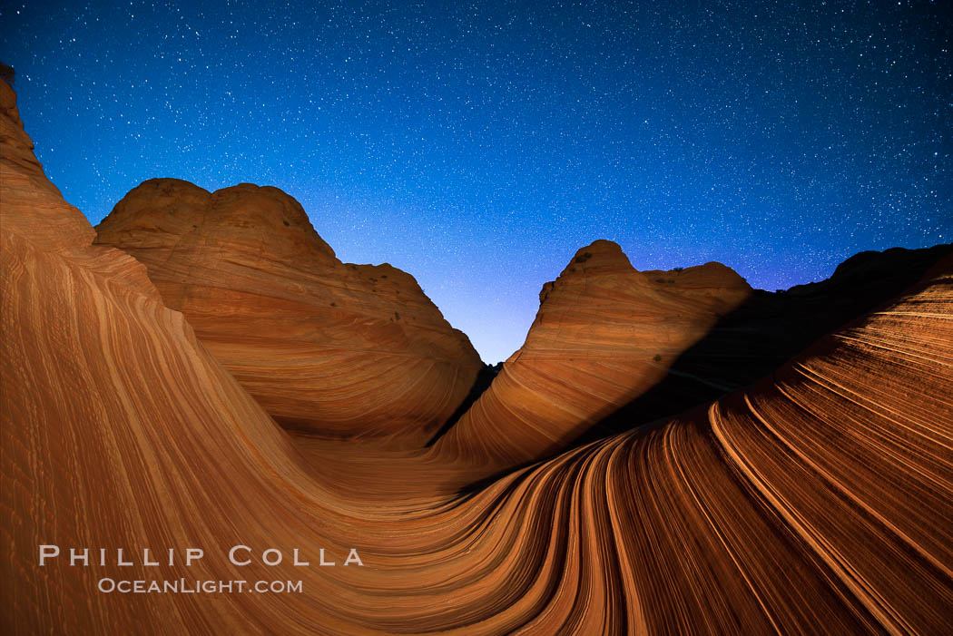 The Wave at Night, under a clear night sky full of stars.  The Wave, an area of fantastic eroded sandstone featuring beautiful swirls, wild colors, countless striations, and bizarre shapes set amidst the dramatic surrounding North Coyote Buttes of Arizona and Utah. The sandstone formations of the North Coyote Buttes, including the Wave, date from the Jurassic period. Managed by the Bureau of Land Management, the Wave is located in the Paria Canyon-Vermilion Cliffs Wilderness and is accessible on foot by permit only. USA, natural history stock photograph, photo id 28626