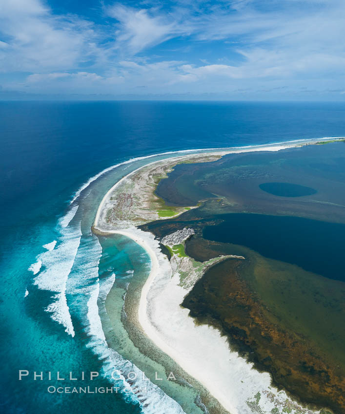 Waves break on the coral reef and wash ashore at Clipperton Island, aerial photo. Clipperton Island, a minor territory of France also known as Ile de la Passion, is a spectacular coral atoll in the eastern Pacific. By permit HC / 1485 / CAB (France)., natural history stock photograph, photo id 32826