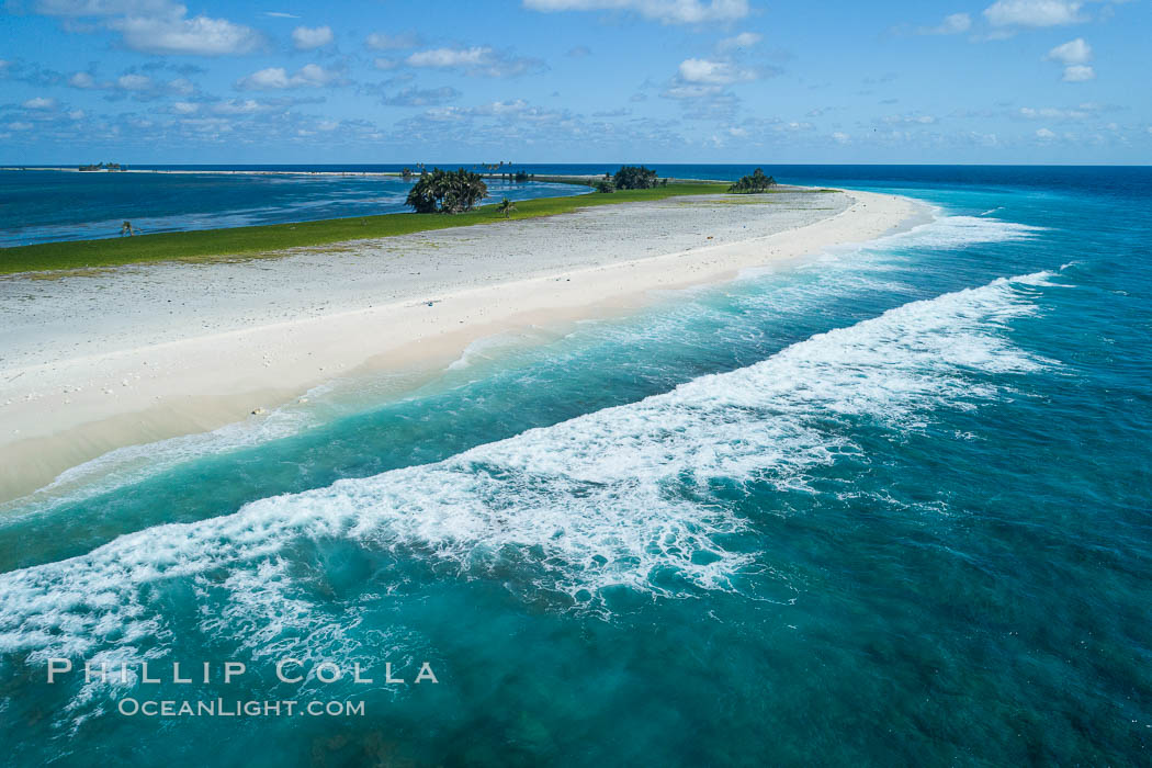 Waves break on the coral reef and wash ashore at Clipperton Island, aerial photo. Clipperton Island, a minor territory of France also known as Ile de la Passion, is a spectacular coral atoll in the eastern Pacific. By permit HC / 1485 / CAB (France)., natural history stock photograph, photo id 32854