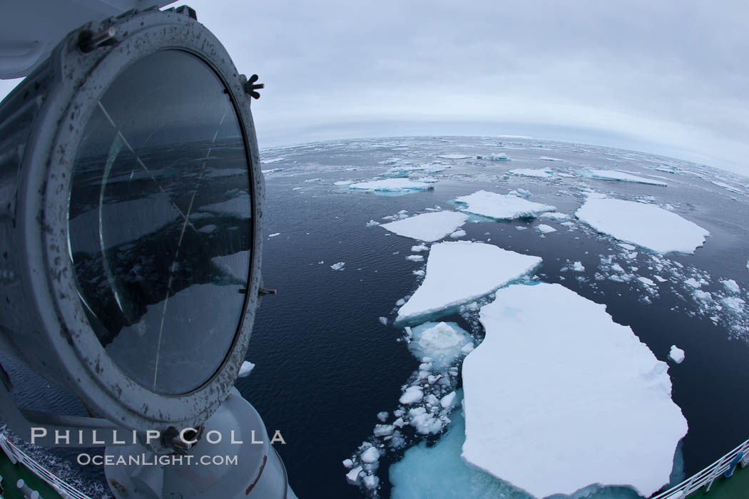 Pack ice and brash ice fills the Weddell Sea, near the Antarctic Peninsula.  This pack ice is a combination of broken pieces of icebergs, sea ice that has formed on the ocean. Southern Ocean, natural history stock photograph, photo id 24843