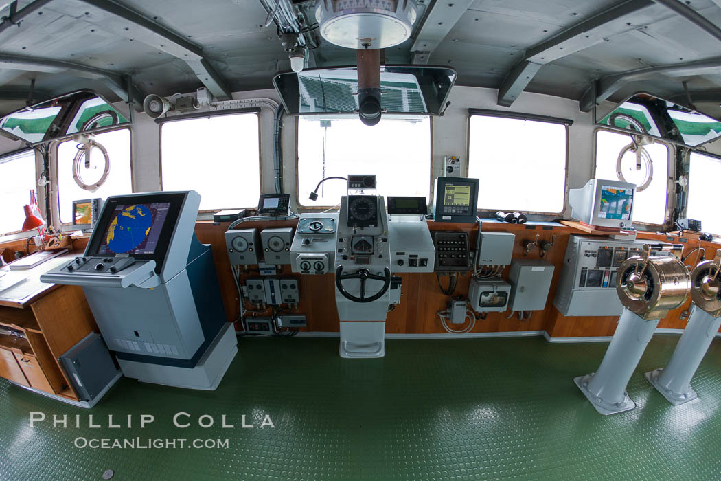 Wheelhouse of the ship M/V Polar Star, with navigation equipment, helm controls, communications, and a great view., natural history stock photograph, photo id 23713