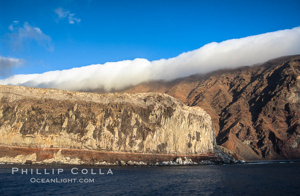 Clouds held back by island crest. Guadalupe Island (Isla Guadalupe), Baja California, Mexico, natural history stock photograph, photo id 03848