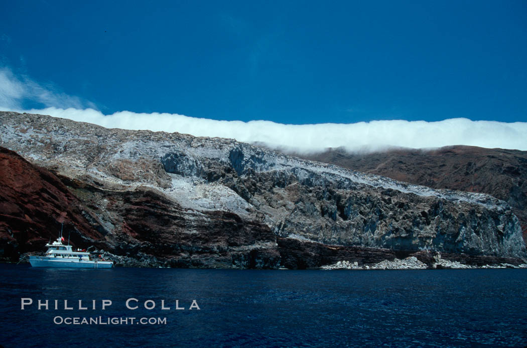 Boat Horizon near Spanish Cove, clouds held back by island crest. Guadalupe Island (Isla Guadalupe), Baja California, Mexico, natural history stock photograph, photo id 03691