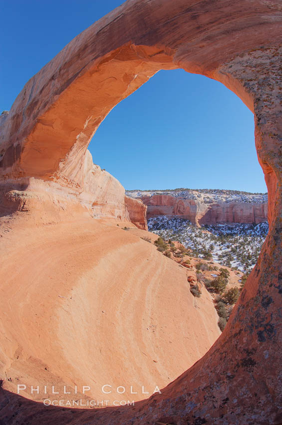 Wilson Arch rises high above route 191 in eastern Utah, with a span of 91 feet and a height of 46 feet. USA, natural history stock photograph, photo id 18032