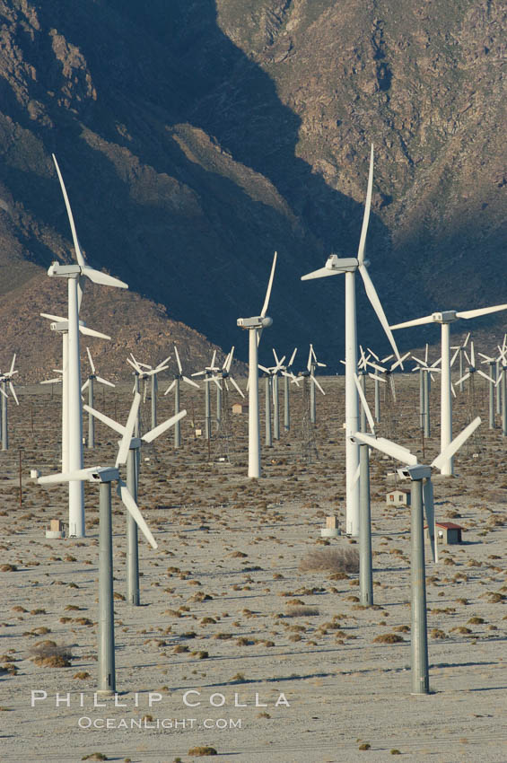 Image 06916, Wind turbines provide electricity to Palm Springs and the Coachella Valley. San Gorgonio pass, San Bernardino mountains. San Gorgonio Pass, California, USA, Phillip Colla, all rights reserved worldwide. Keywords: california, coachella valley, desert, electricity, energy, palm springs, power generation, san gorgonio pass, san gorgonio pass wind farm, science and technology, usa, wind farm, wind power, wind turbine, windmill.