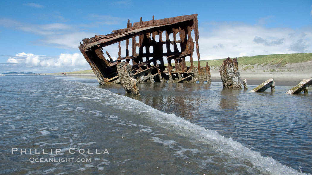 Wreck of the Peter Iredale, rusting away in the sand at the ocean's edge. Fort Stevens State Park, Oregon, USA, natural history stock photograph, photo id 19447