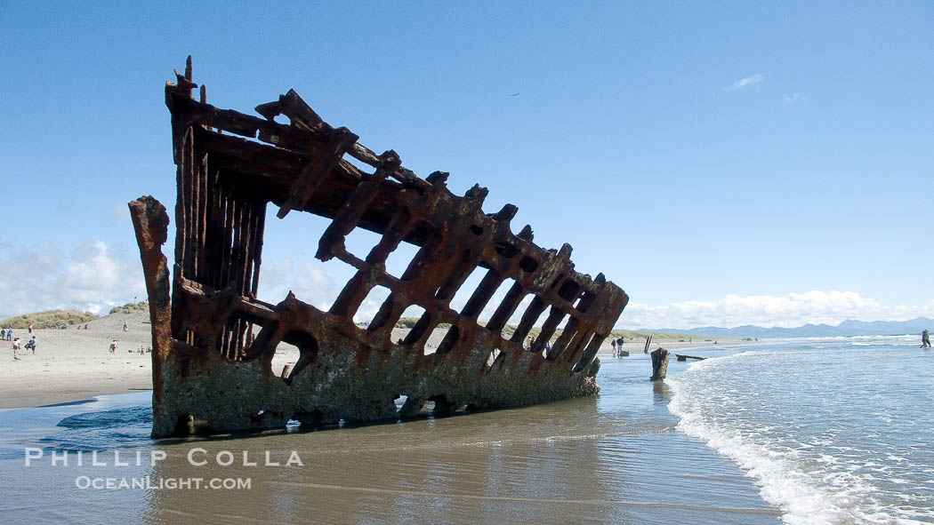 Wreck of the Peter Iredale, rusting away in the sand at the ocean's edge., natural history stock photograph, photo id 19449