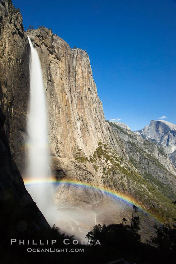 Yosemite Falls and rainbow, Half Dome in distance, viewed from the Yosemite Falls trail, spring, Yosemite National Park, California