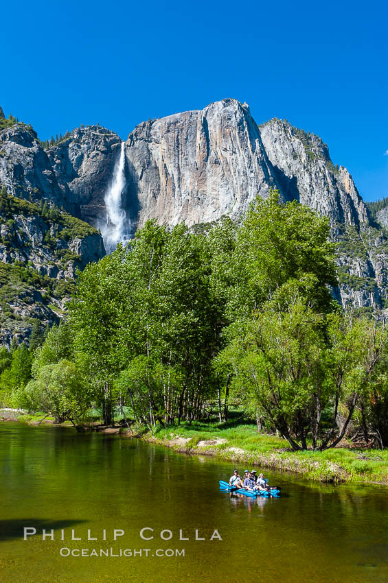 Rafters enjoy a Spring day on the Merced River in Yosemite Valley, with Yosemite Falls in the background. Yosemite National Park, California, USA, natural history stock photograph, photo id 09209