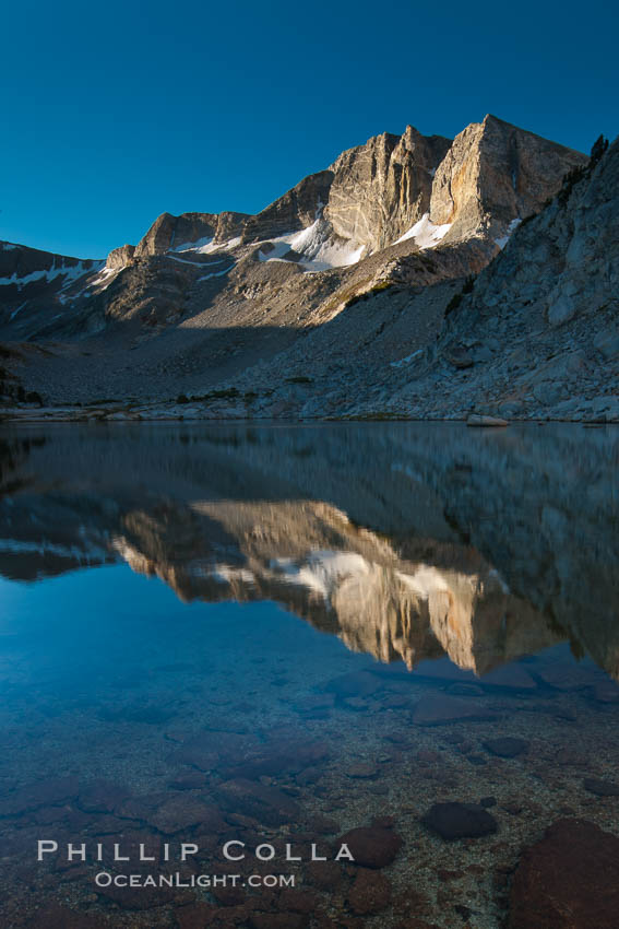 Cathedral Range peaks reflected in the still waters of Townsley Lake at sunrise. Yosemite National Park, California, USA, natural history stock photograph, photo id 25781