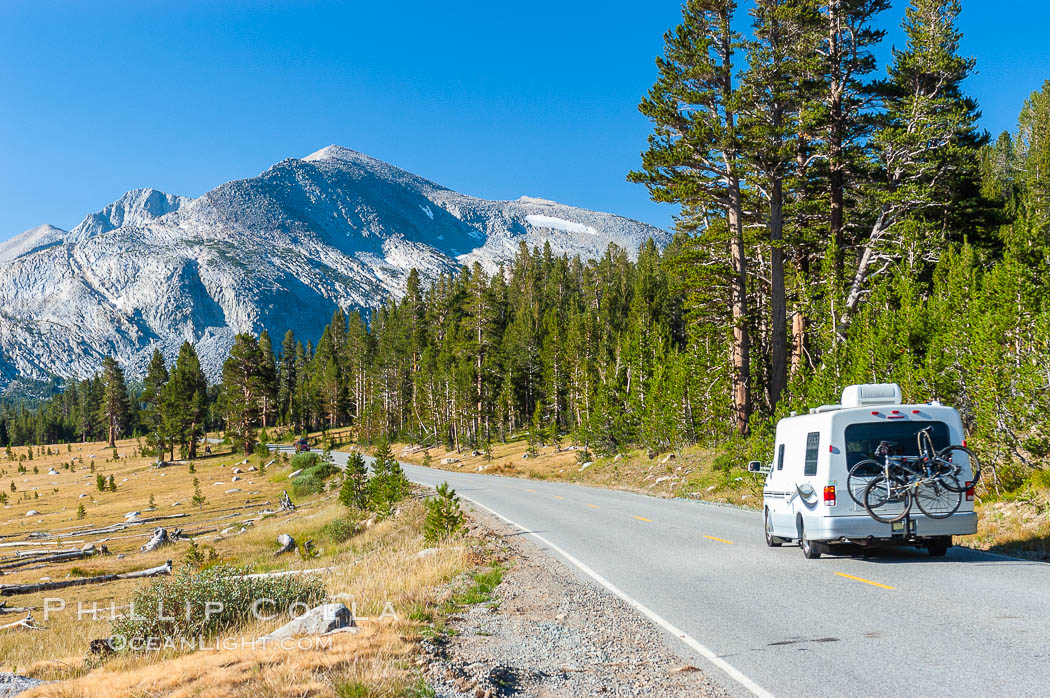 A motorhome passes by alpine meadows and Mammoth Peak as it travels westward along the Tioga Pass road into Tuolumne Meadows in the High Sierra. Yosemite National Park, California, USA, natural history stock photograph, photo id 09976