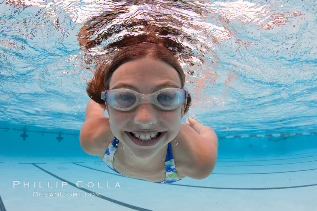 Young girl swimming in a pool., natural history stock photograph, photo id 25290