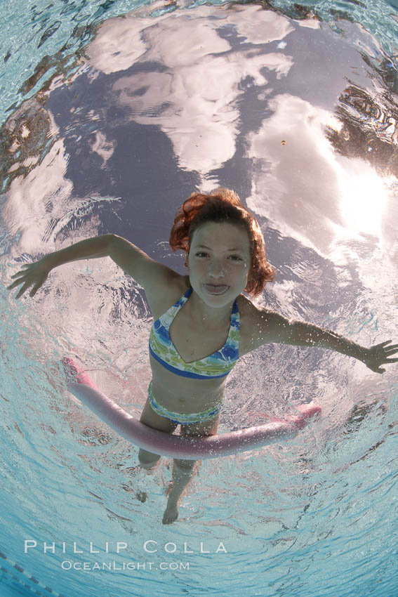 Young girl swimming in a pool., natural history stock photograph, photo id 25288