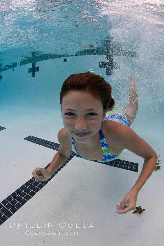 Young girl swimming in a pool., natural history stock photograph, photo id 25289