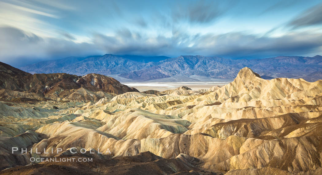 Zabriskie Point sunrise, clouds blurred by long time exposure, Death Valley National Park, California. USA, natural history stock photograph, photo id 27655