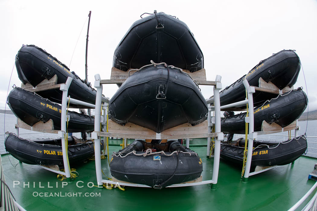 Zodiac boats are stacked on the top deck of the ship M/V Polar Star.  They are lowered into the water for passengers to go ashore and explore., natural history stock photograph, photo id 23710